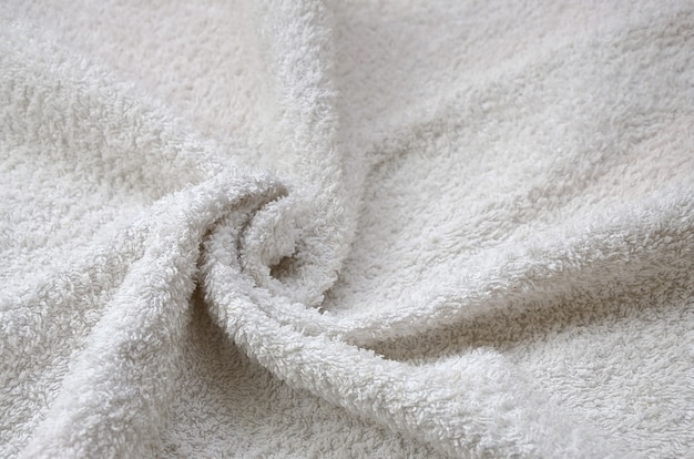 White natural cotton towel background texture with many folds