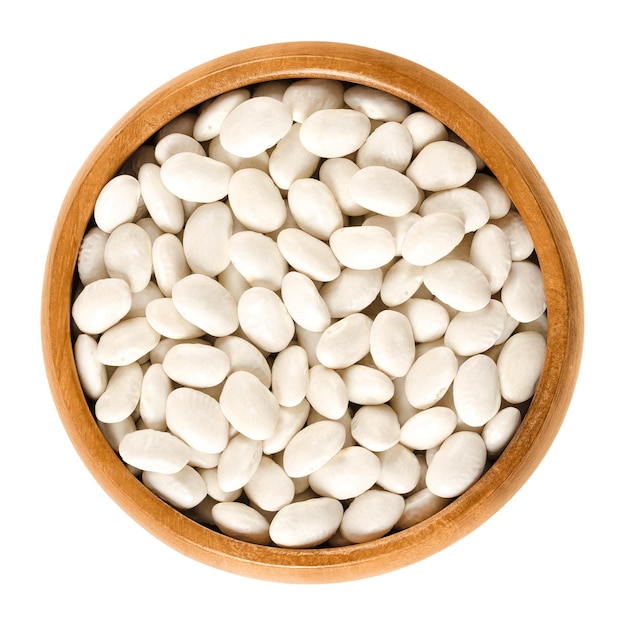 White navy beans in wooden bowl