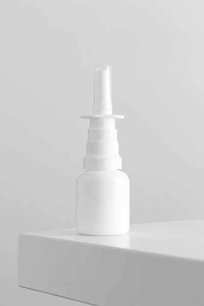 White nose spray bottle mockup on a white table