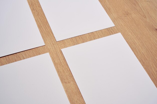 Photo white note papers on a wooden table.