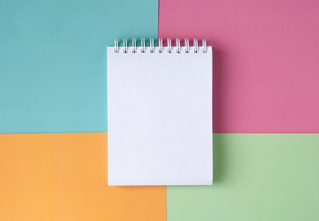 Premium Photo | White notebook on a multicolored background