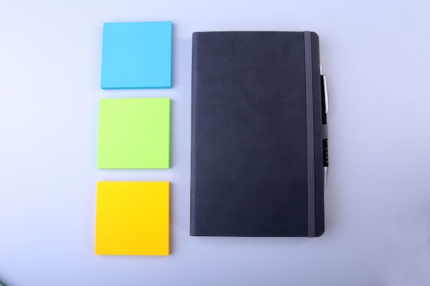 White notepad with colorful sticky reminder notes