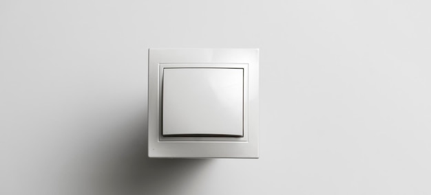 A white on and off electric light switch at home