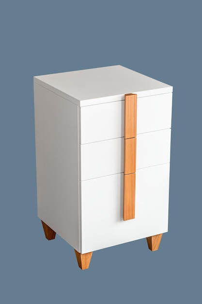 White office chest of drawers with natural wooden brown handles and legs isolated on blue background