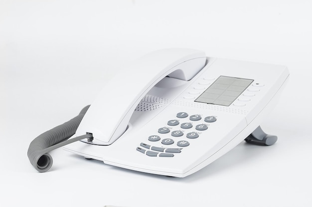 White office desk phone isolated on whitex9