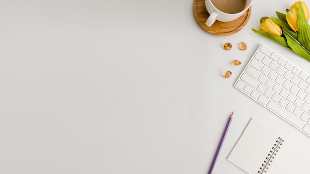 White office desk table. Flat lay.