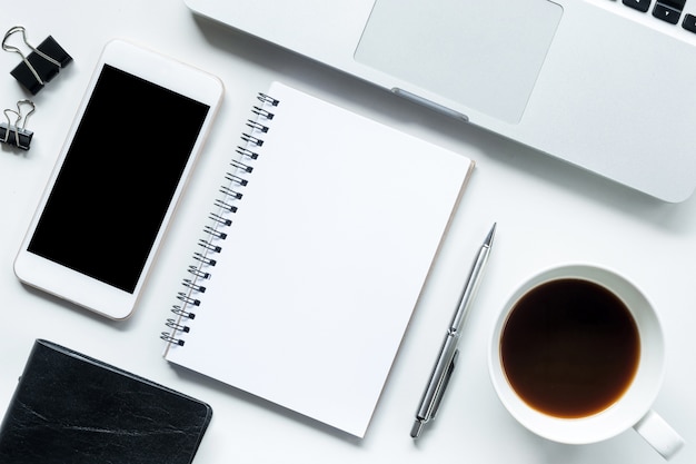 White office desk table with notebook