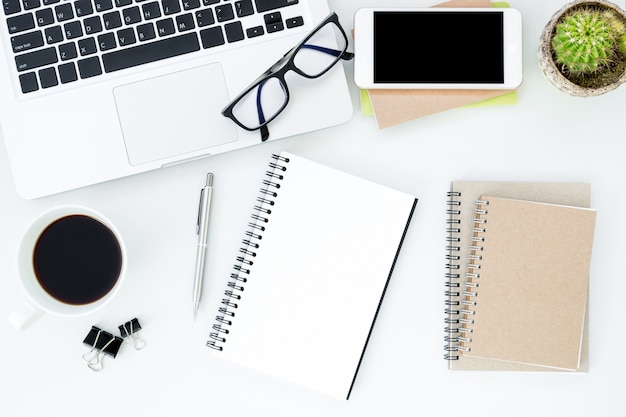 White office desk with supplies