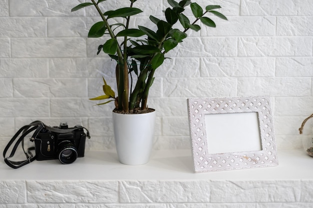 white old photo frame on a white wall background