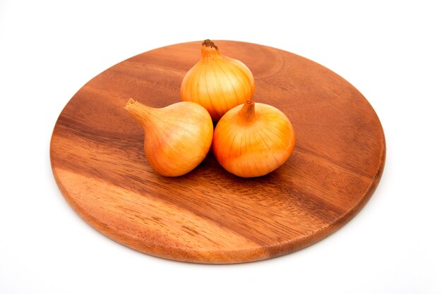 White onion on a wooden chopping Board