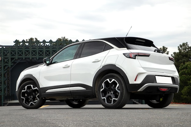 A white Opel Mokka is parked on a driveway