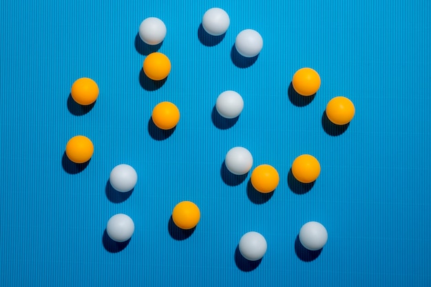 White and orange balls on a blue background