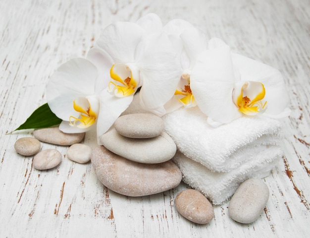 White orchids with massage stones