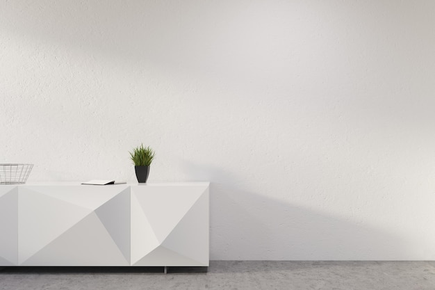Фото Белая оригинальная стойка регистрации с растением в горшке, стоящим в пустой комнате с белыми стенами и бетонным полом. 3d рендеринг макет