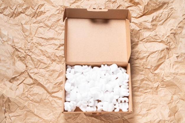 White packaging chips styrofoam peanut in cardboard box