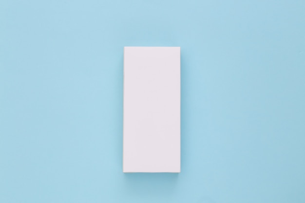 White packing box on blue. Minimalism