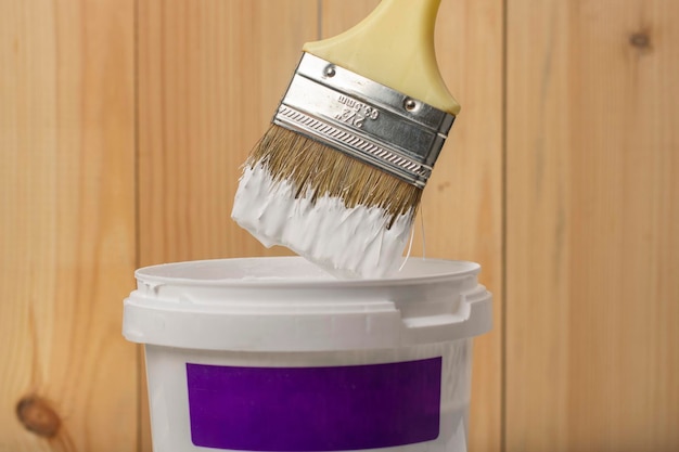 White paint on a brush close-up.