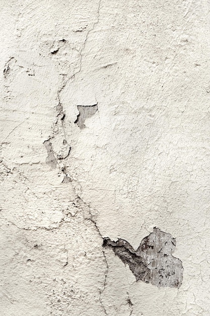 Photo white painted cracked plastered wall with cracks old distressed damage surface high resolution background image element with copy space text place top view flat lay on plain surface