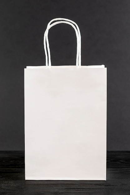 White paper bag on black background