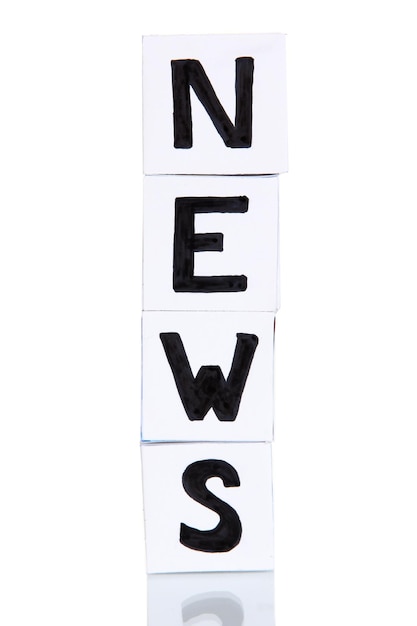 White paper cubes labeled News isolated on white