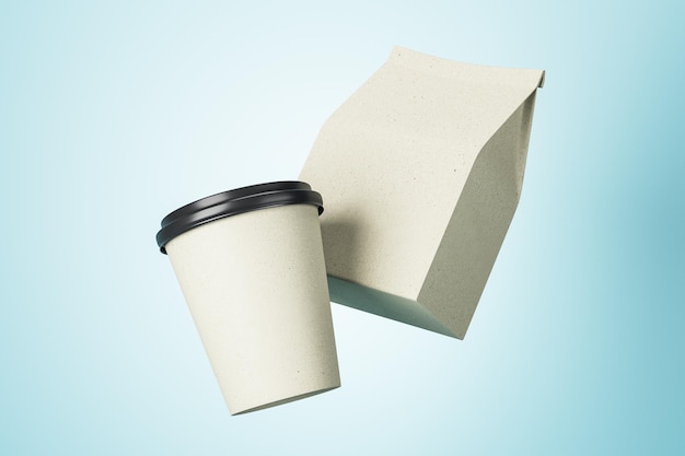 White paper cup to go and white coffee package with copyspace\
for your logo at blue background mockup