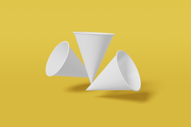 Photo white paper cups cone shaped on a yellow background