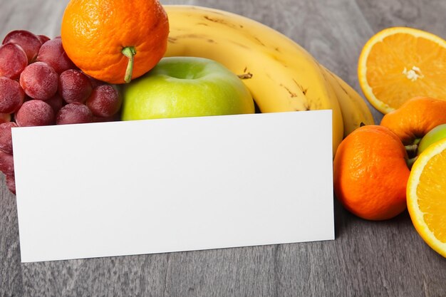 Photo white paper mockup enhanced by fresh fruit creating a visual feast of wholesome design and vibrant