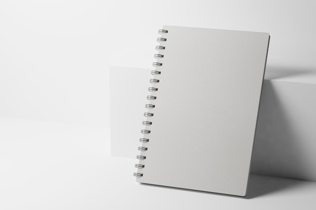 Photo white paper notebook near the white box 3d rendering