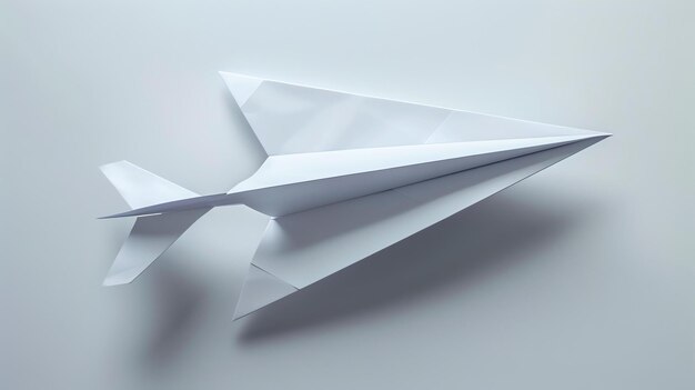 Photo a white paper plane is flying on a white background the plane is made of a single sheet of paper and it is folded into a simple design