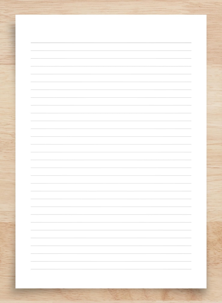 Photo white paper sheet isolated on wood background with clipping path close up