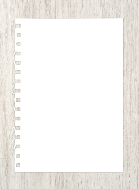 White paper sheet on wood for background.