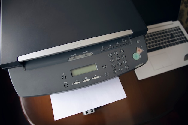 White paper sheets on the printer in office