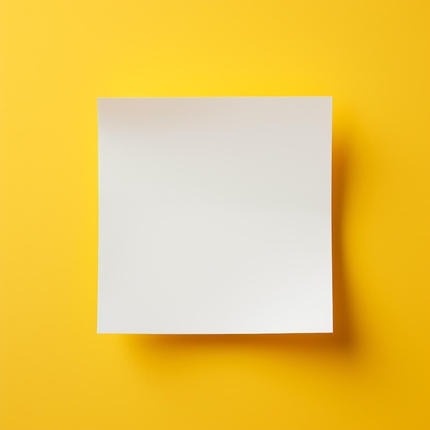 Photo a white paper on soft yellow desk