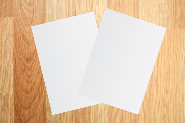 White paper and space for text on brown wooden background