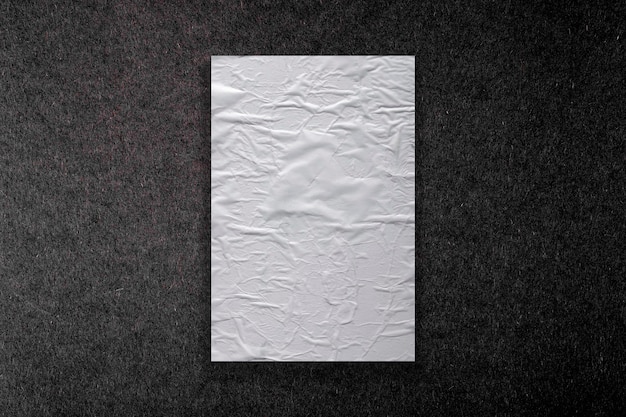 Photo white paper with folds texture on dark background