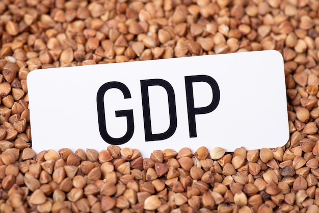 White paper with GDP inscription on buckwheat