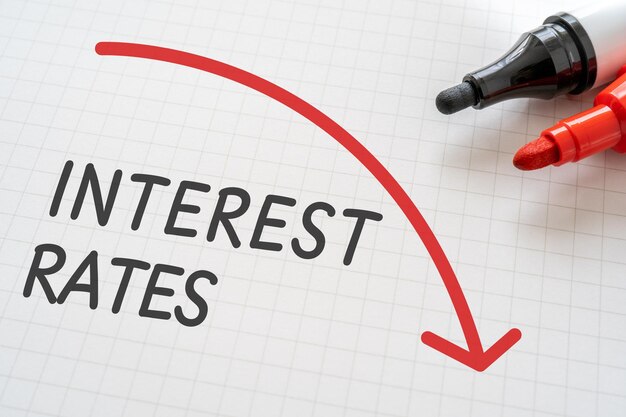 White paper written INTEREST RATES with markers.