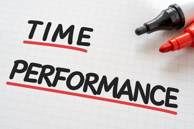 White paper written TIME PERFORMANCE with markers.