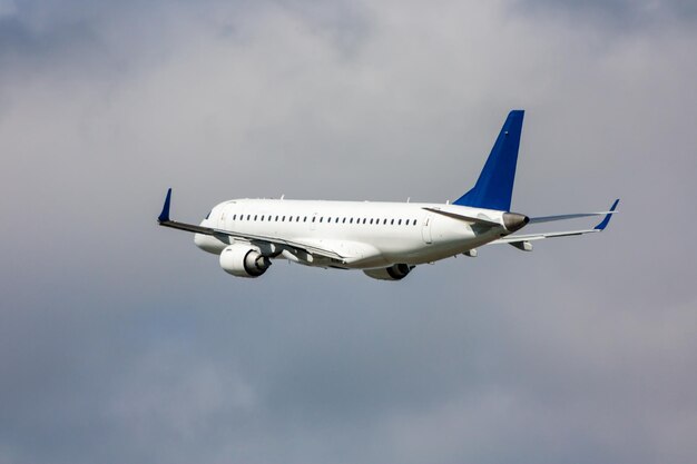 White passenger jet plane in the air on take-off