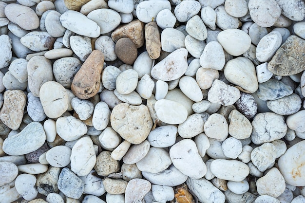 White pebbles stone or river stone texture and background