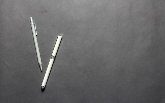 white pen isolated from gray background