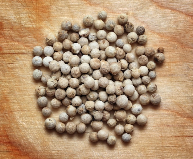 White pepper macro on wooden board