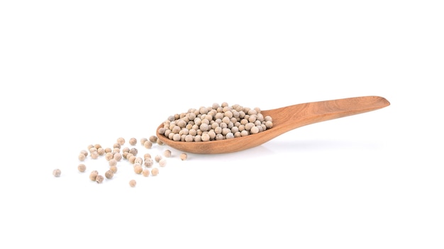 White Pepper seeds in wooden spoon