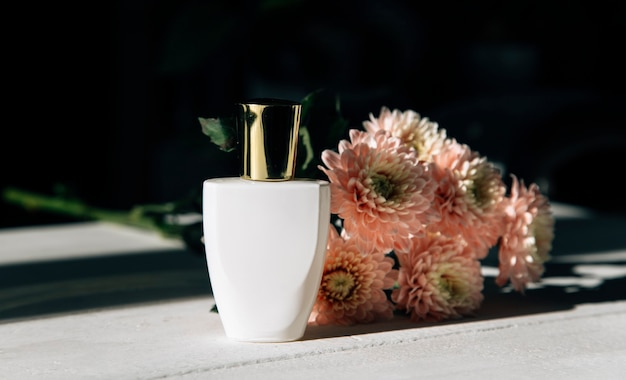 white perfume bottle on a light background