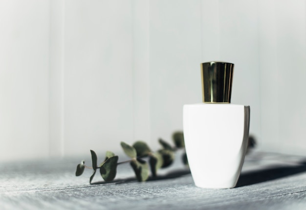 white perfume bottle on a light background