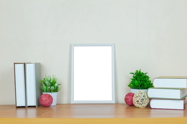 white picture frame on wood table.