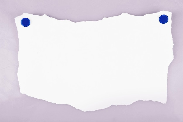 White piece of paper attached on white background