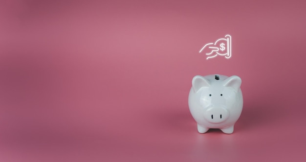 White piggy bank on a pink background Savings and investment concepts