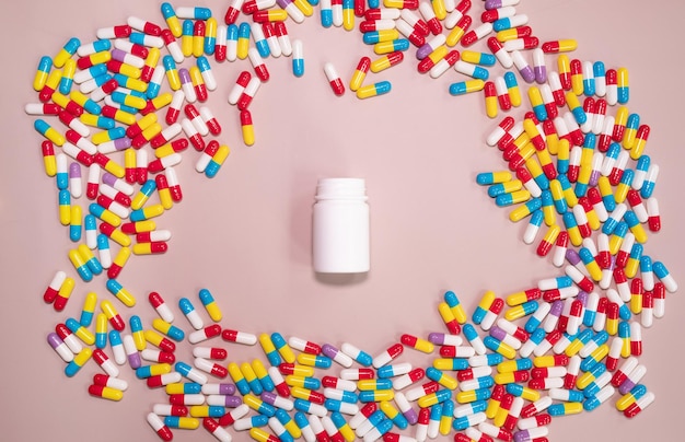 A white pill bottle is surrounded by a pill bottle.