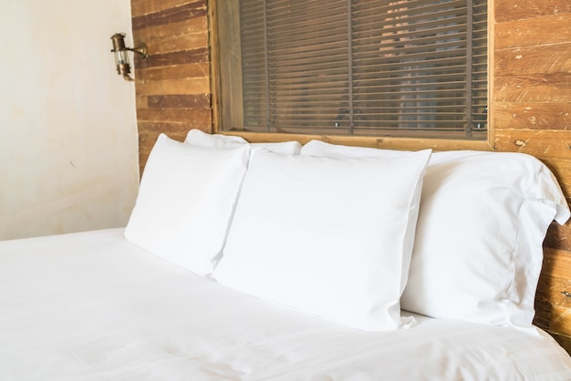 white pillow on bed